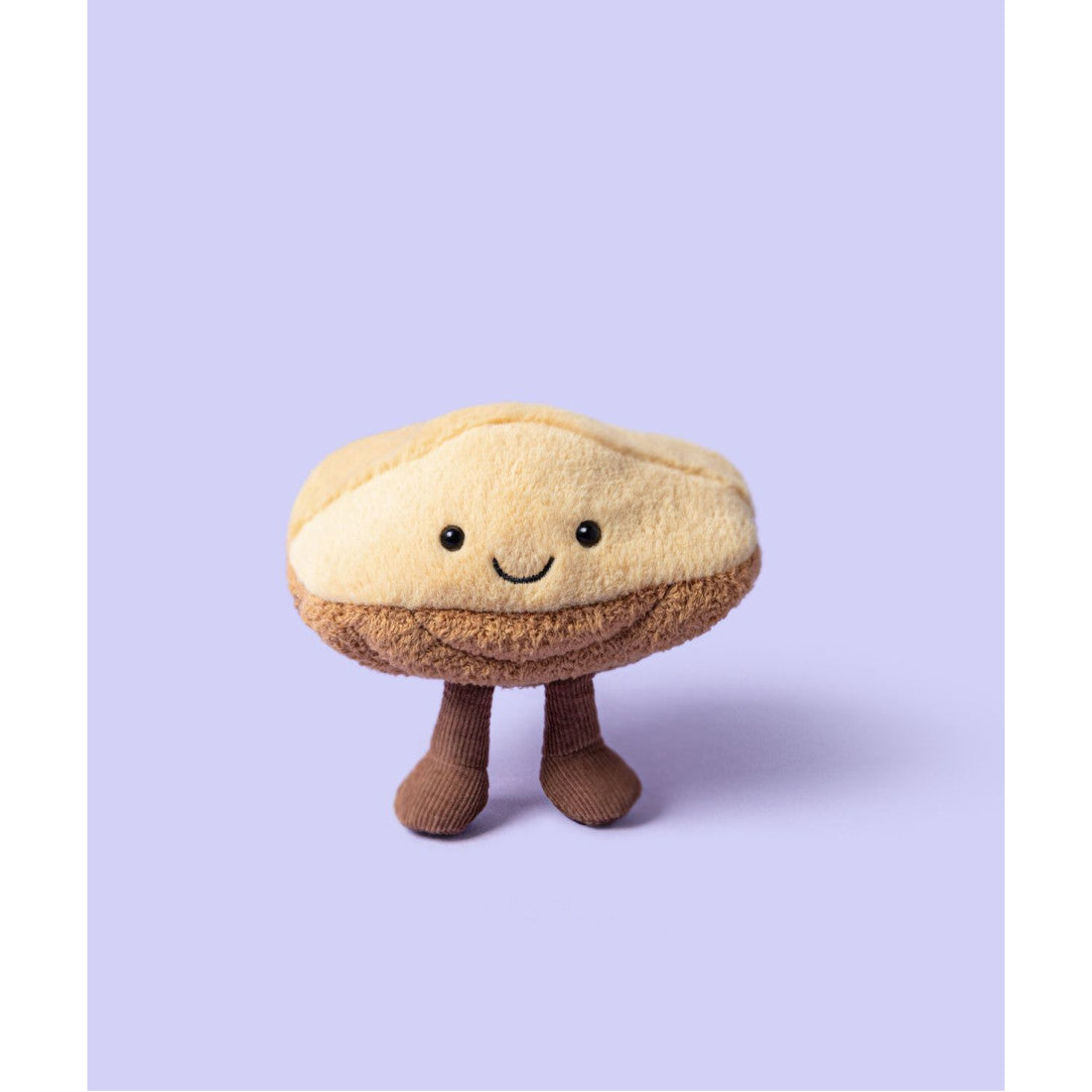 Maskotka Jellycat Amuseables – Magdalenka Margaux 13 cm, na nóżkach, zdjęcie na liliowym tle