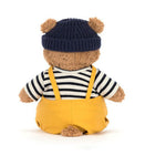 Miś Bartłomiej Jellycat od tyłu – szelki żółtych ogrodniczek