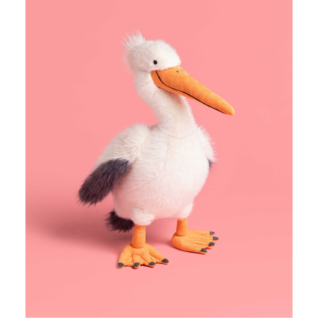 Maskotka Jellycat – Pelikan Keli 34 cm, pelikan na stojąco, na różowym tle