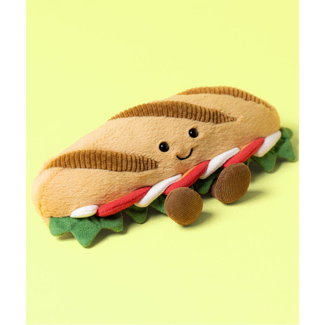 Maskotka Jellycat Amuseables – Bagietka Caprese 12 cm, zdjęcie na żółtym tle