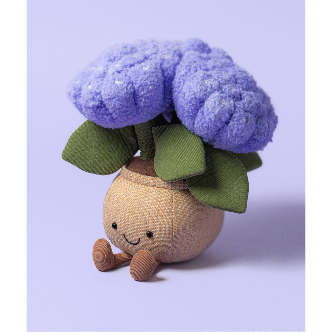 Maskotka Jellycat Amuseables – Hortensja 24 cm, zdjęcie na liliowym tle
